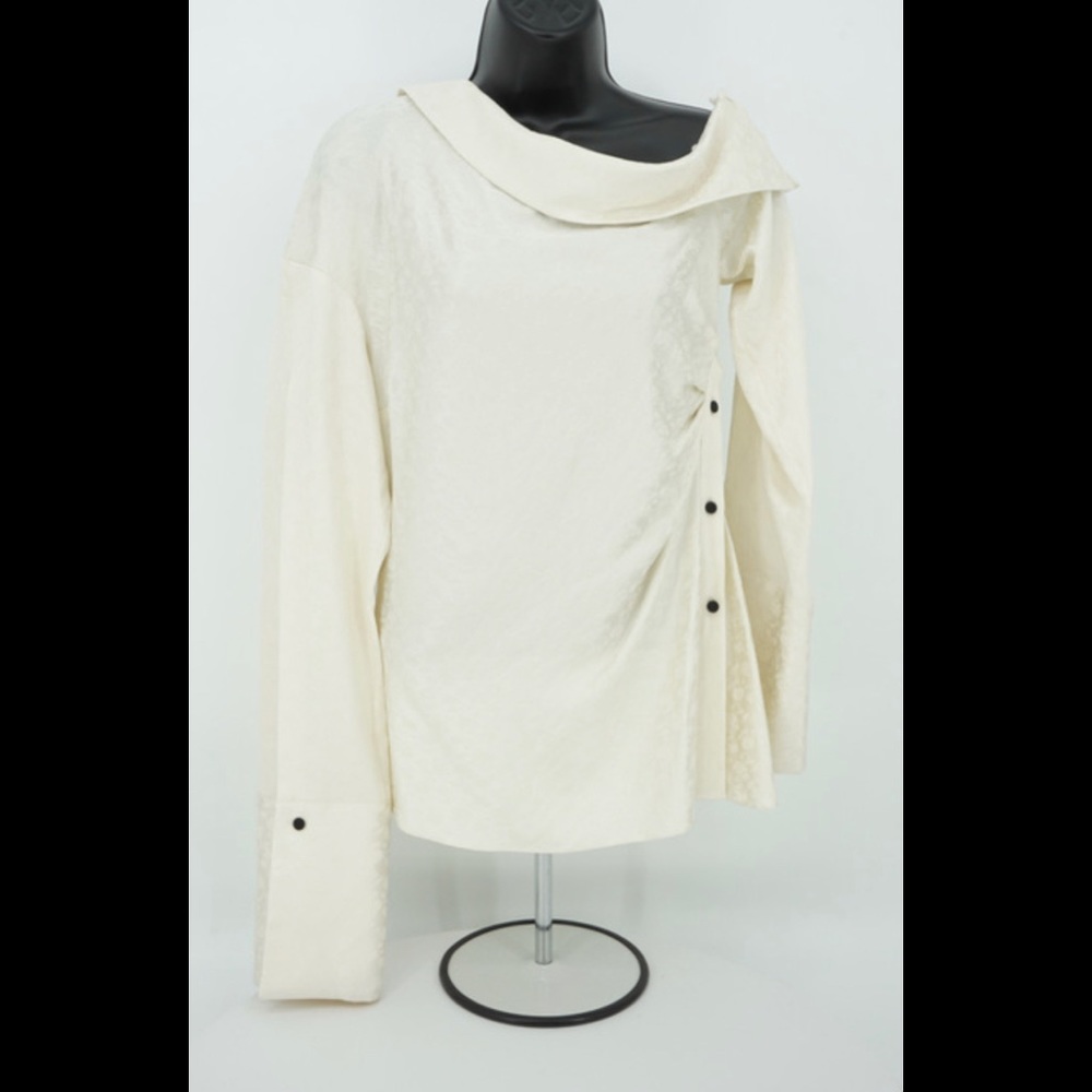 From the set of HBO’s INSECURE, Asymmetric Ivory Top by Hellessy